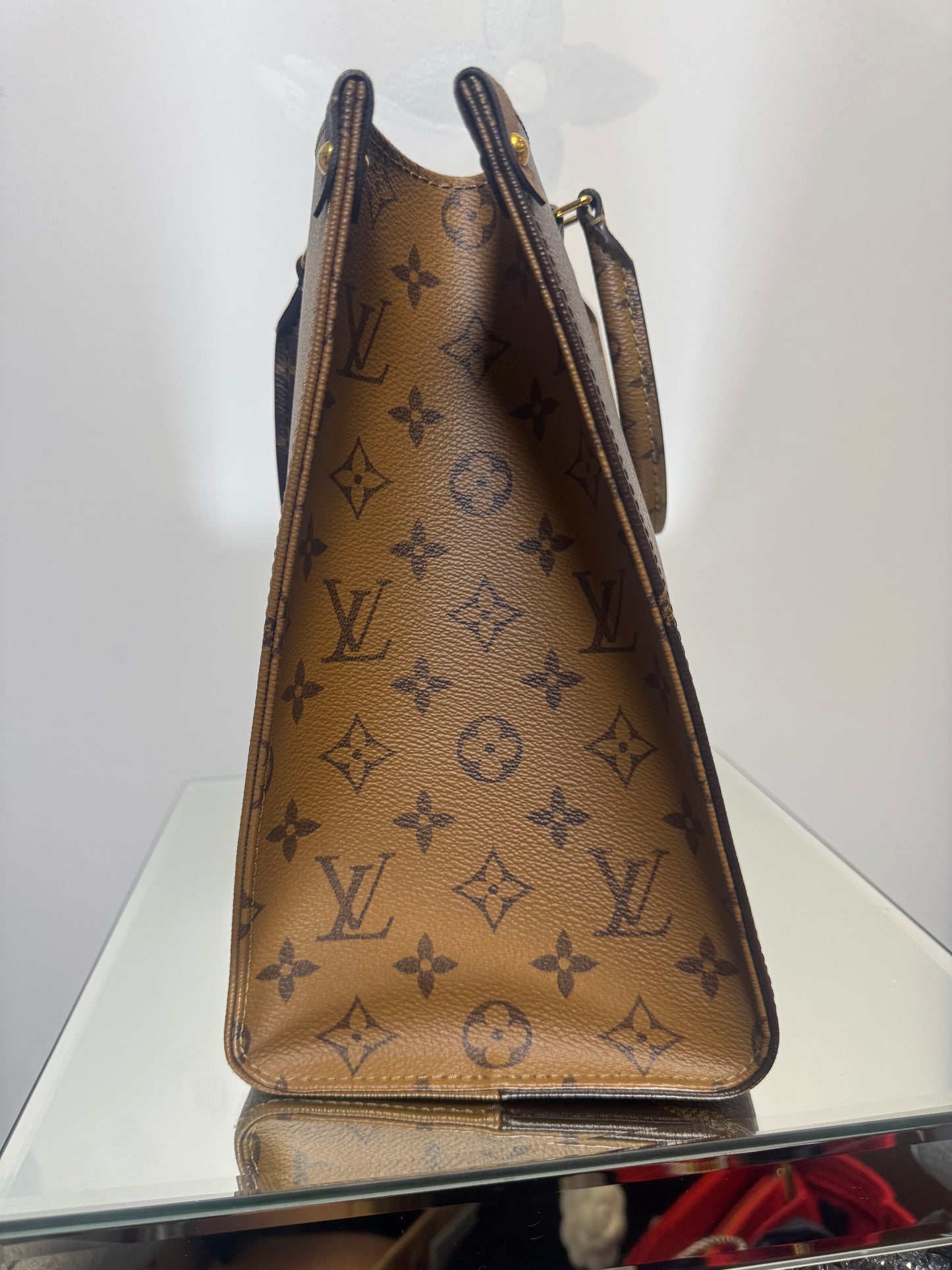 LOUIS VUITTON ON THE GO MM REVERSE MONOGRAM