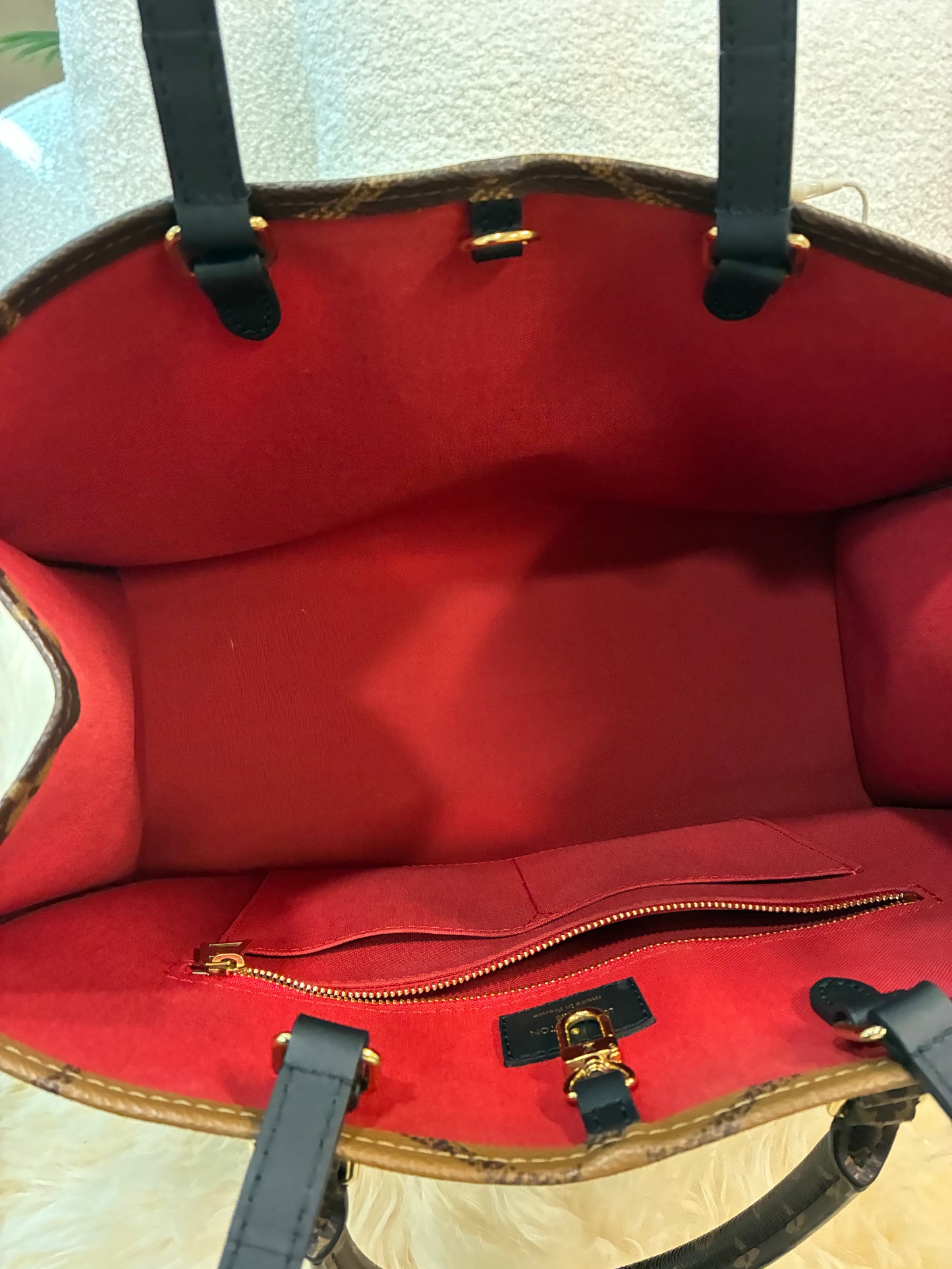 LOUIS VUITTON ON THE GO MM REVERSE MONOGRAM