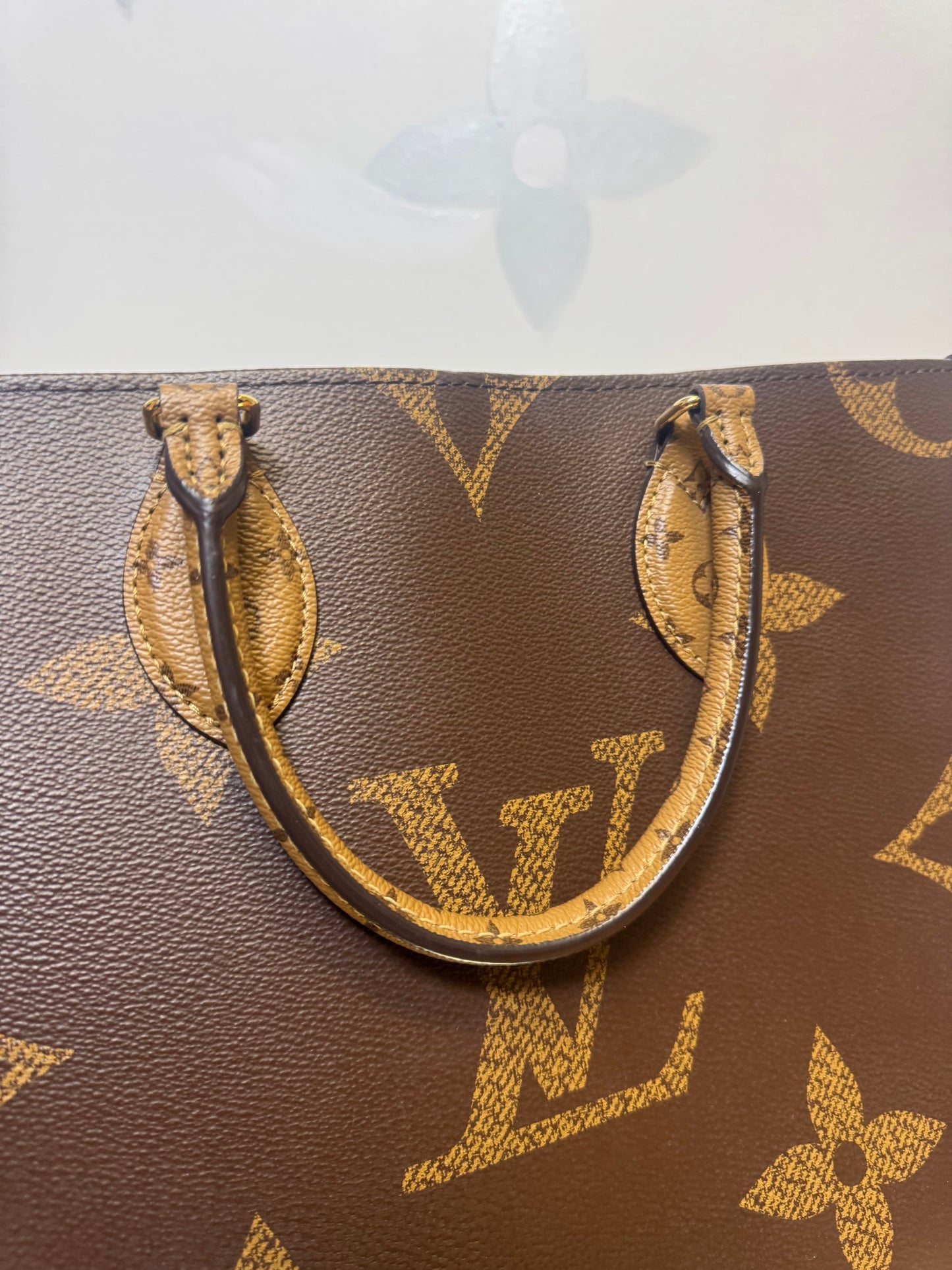 LOUIS VUITTON ON THE GO MM REVERSE MONOGRAM