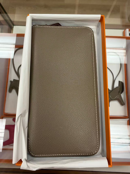 HERMÈS ZIP AROUND LONG WALLET IN ETOUPE GRAY