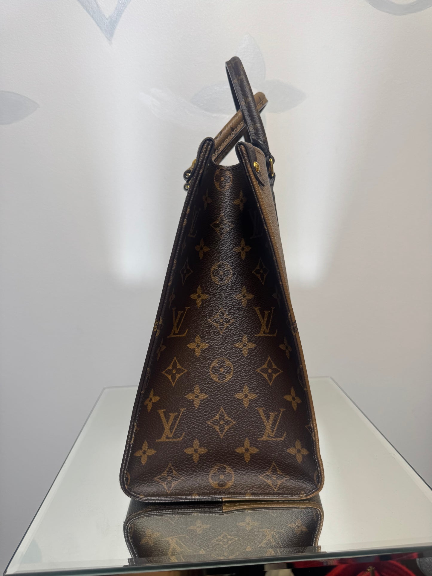 LOUIS VUITTON ON THE GO MM REVERSE MONOGRAM